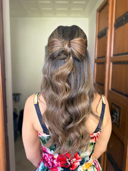 The full back view of the hair bow hairstyle.
