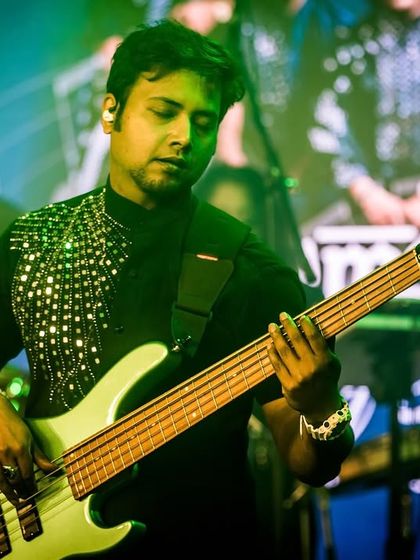 Our bassist, focused and in the groove during our performance at Bangalore Club.
