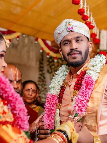 A portrait of the groom looking at his bride during the wedding ceremony. We capture the love and admiration in his eyes.