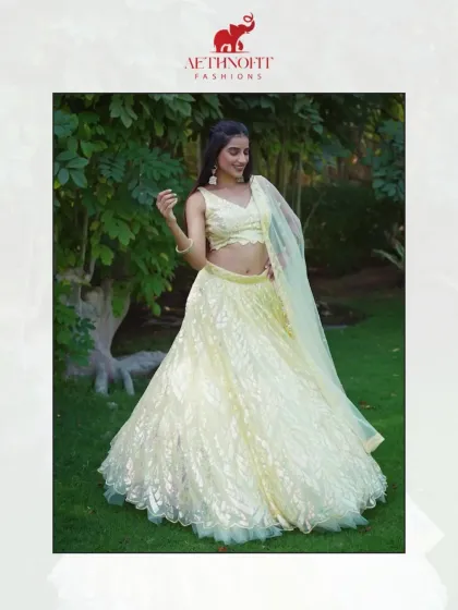 Glow like golden sunlight in this yellow organza lehenga. I designed it to be airy and light, with delicate sequin detailing that catches the light with every move.