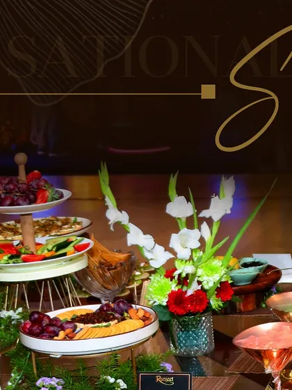 A vibrant grazing table featuring fresh fruits, vegetables, cheeses, and dips. These spreads are perfect for cocktail parties and encourage social, interactive dining.