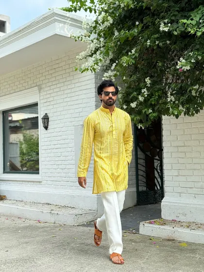 A candid shot of the yellow patterned kurta in motion. This demonstrates the comfortable fit and breathable fabric, making it an ideal choice for events that last all day.