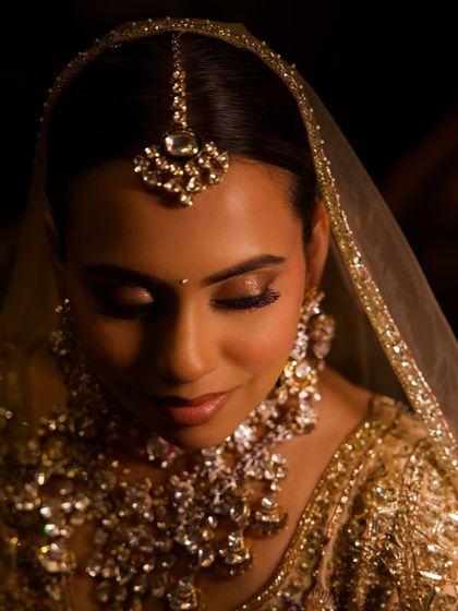 A stunning, artistic portrait of the bride. The focus is on the shimmering eye makeup, a technique you'll learn for adding glamour to a minimal look.