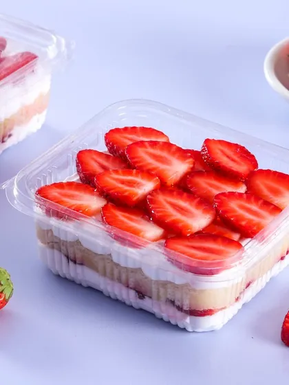 A clean, simple shot of our Strawberry Vanilla Tub. You can see the distinct layers of cake, cream, and fresh strawberries, showcasing the freshness and quality of the ingredients I use.