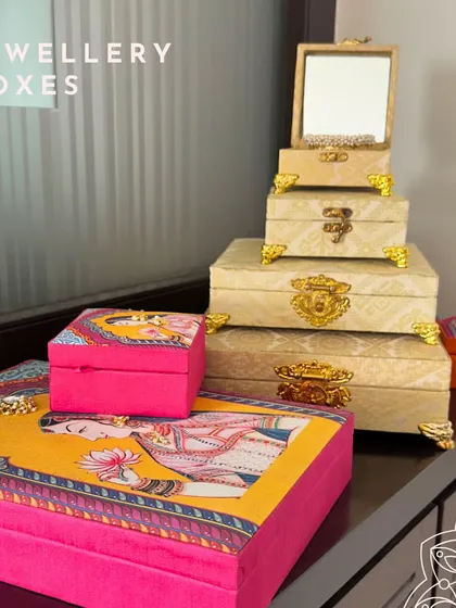 This image shows how you can mix and match my jewelry box collections. The regal Pichwai-style boxes pair beautifully with the classic cream and gold brocade set for a truly customized trousseau.