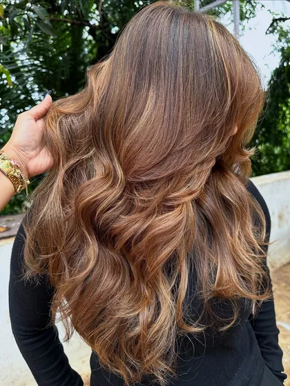 Her crowning glory. This stunning 'Butter Blonde' is warm, bright, and full of dimension. I used a balayage technique to create a natural, sun-kissed effect.