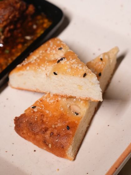 A classic done the Comorin way. Our smoky and spicy mutton seekh kebab arrives sizzling in its own juices, ready to be mopped up with our soft, house-made bread.