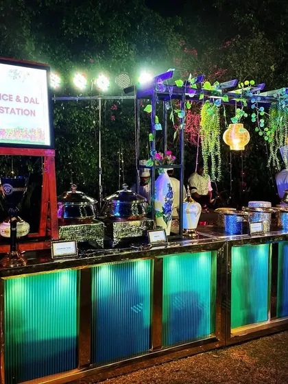 Presentation matters just as much as taste. Here is one of our beautifully arranged rice and dal stations at an event at Novotel Imagica, complete with elegant lighting and decor to match the party's theme.