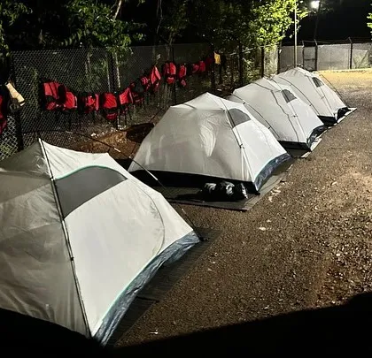This is what camp life looks like after a day of adventure at our Dandeli course. Participants rest in their tents, sharing stories under the stars, ready for the next day's challenges.