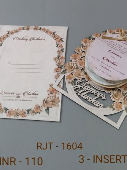 A truly unique invitation with a circular, multi-page insert set inside a floral laser-cut frame. The couple's names are also laser-cut, making this a very special design.