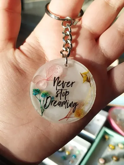 This floral keychain carries an inspiring message: "Never stop dreaming." It's a perfect small gift to offer a bit of encouragement, and I can customize it with any quote you like.