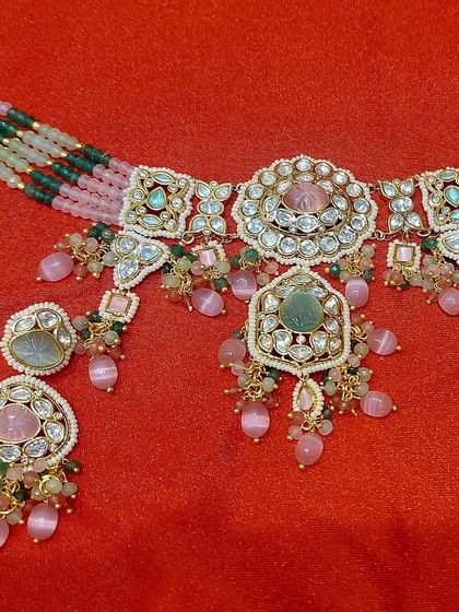 A close-up of the pastel pink and green choker set. The design is fresh, modern, and perfect for someone who wants to stand out.