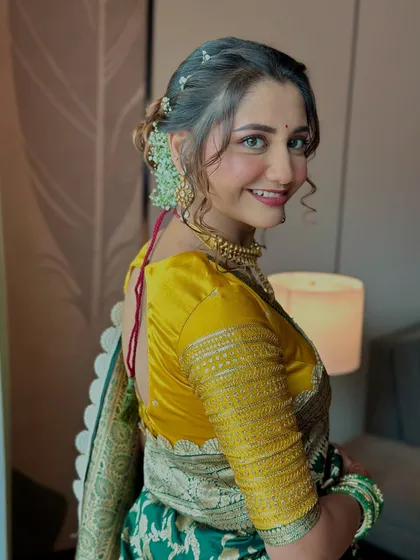 A bright and happy portrait. Her smile is infectious, and the makeup is kept fresh and light to match her joyful vibe.