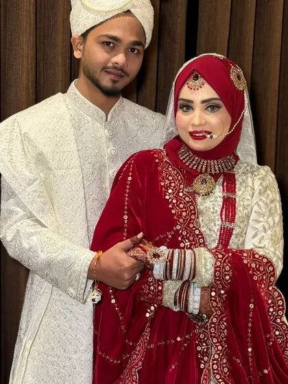 A loving moment between the bride and groom. Her makeup is designed to last through all the emotional moments of the day.
