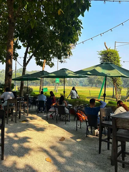 The cafe patio offers a front-row seat to the action on the driving range.