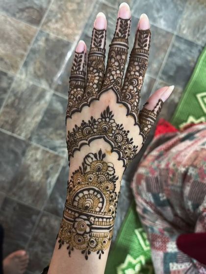 A clear shot of the Pakistani henna cuff, showing the detailed linework and traditional motifs.