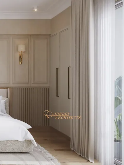 A bright bedroom corner showing the elegant wardrobe design and sheer curtains that filter natural light beautifully.