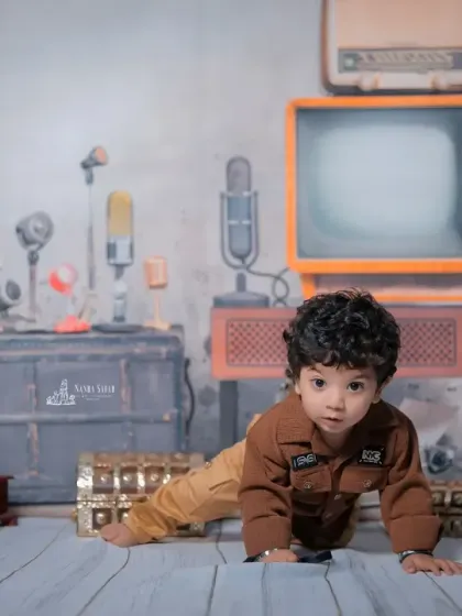 Here is a full view of my 'Chhota RJ' or retro radio jockey theme. The set is filled with vintage props like an old television, classic microphones, and a guitar to create a unique, nostalgic vibe for your baby's photoshoot.