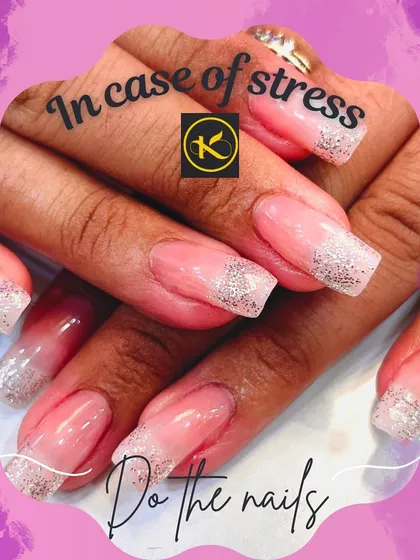 A classic and elegant take on glitter nails. These square-shaped extensions feature a natural pink base with a clean, sparkling silver glitter tip, similar to a French manicure but with more glamour.