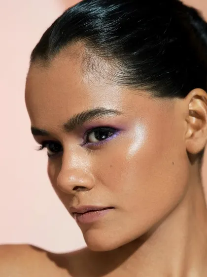 A final portrait of this gorgeous lilac look. The highlight on the cheekbone complements the shimmer in the eyeshadow, tying the whole look together.
