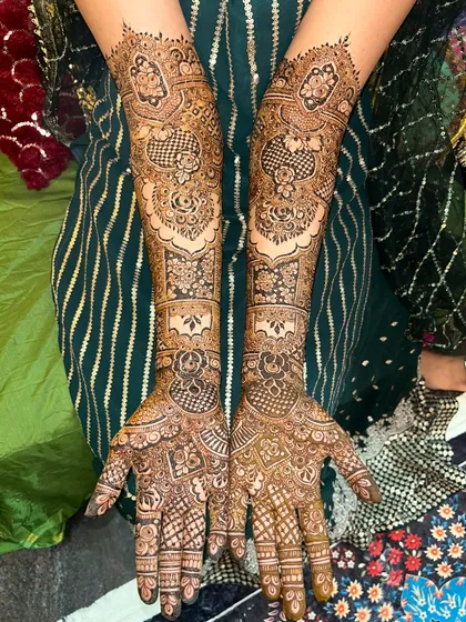 Another angle of this beautiful bridal design. The patterns are symmetrical yet unique, creating a balanced and interesting look.