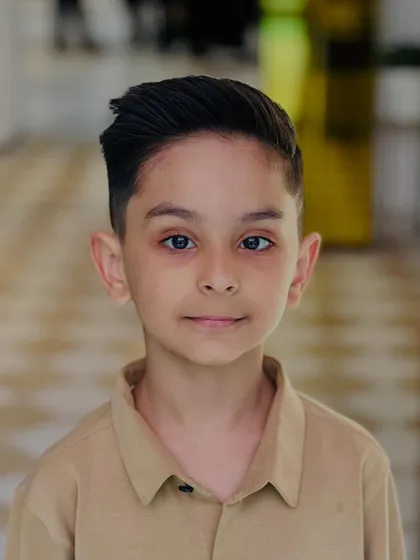 A sharp, clean haircut for a young gentleman. We make the salon experience fun and comfortable for all ages.
