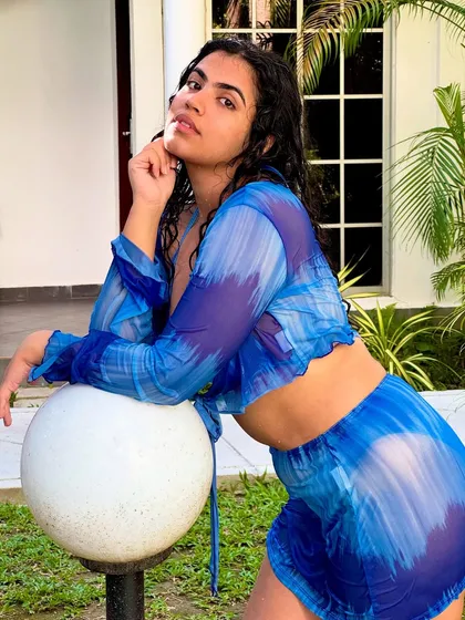 Leaning on a lamp post, but make it fashion. This pose shows off the full three-piece set.
