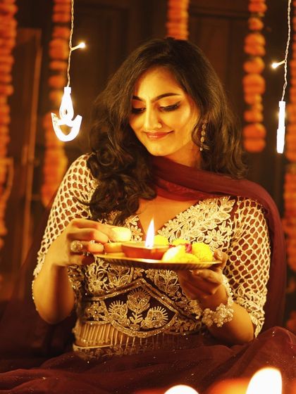 A festive shot featuring a traditional outfit and makeup. The look is elegant and perfect for celebrating Diwali with family and friends.