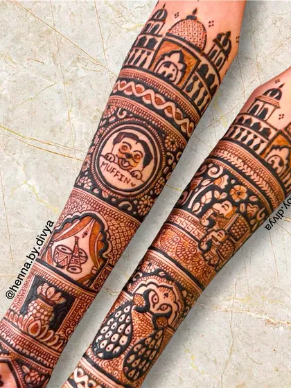 This bridal design includes a very personal touch: a portrait of the bride's beloved pet dog, Muffin. The rest of the design is filled with royal palace architecture and peacock motifs.
