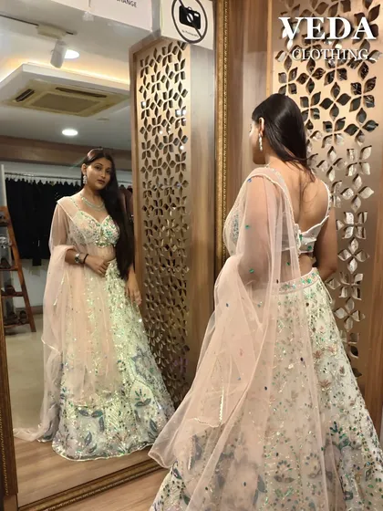 Admiring the reflection. The back of this lehenga is just as beautiful as the front.