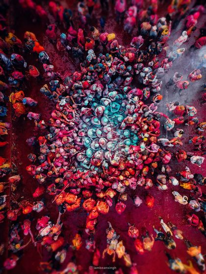 A kaleidoscope of colors from the sky. This is my drone shot of Holi at Nandgaon Temple, where the swirls of gulal create a living piece of art, symbolizing love, unity, and celebration.