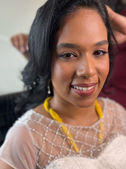 A happy portrait of Aruna. Her makeup is subtle and skin-like, letting her natural beauty be the focus.