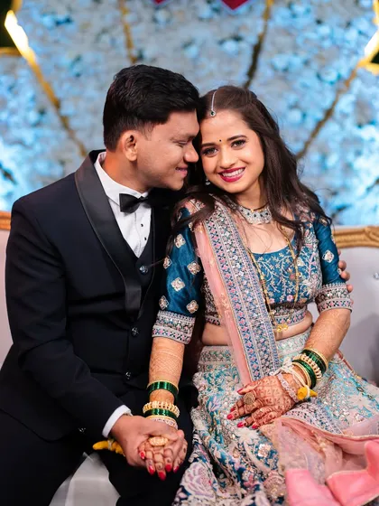 An intimate and happy close-up of the couple during their wedding reception.