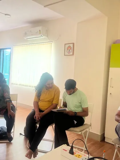 It's not just physical work. Here, couples are taking notes and engaging with the informational part of our workshop, learning to make informed decisions for their birth journey.