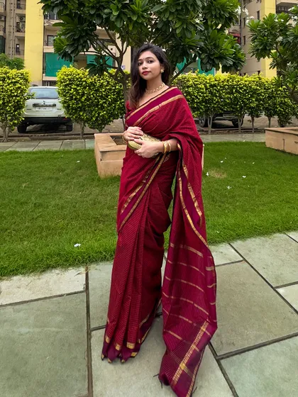 The full look in the park. The rich maroon color looks stunning against the green background.