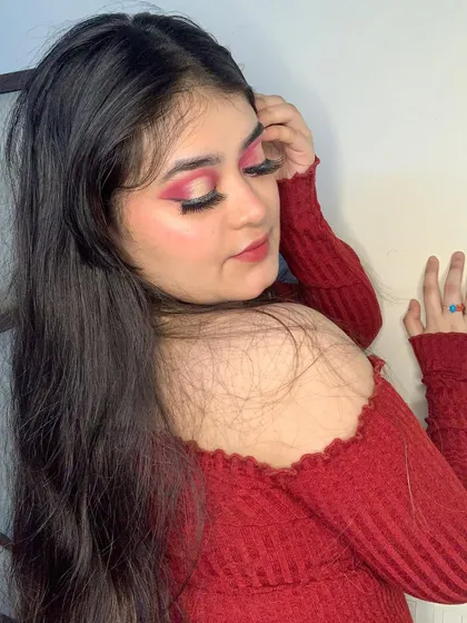 Another view of the intense red smokey eye, showing the blending and depth of color.