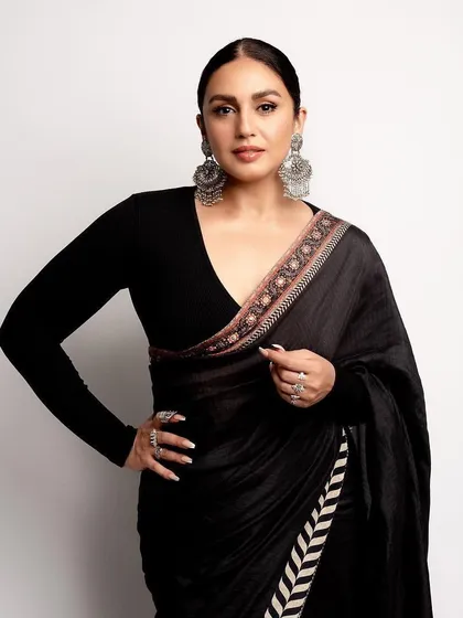 A modern and powerful look featuring a black JJ Valaya saree. The full-sleeve blouse and statement silver jewelry create a look that is both bold and beautiful.