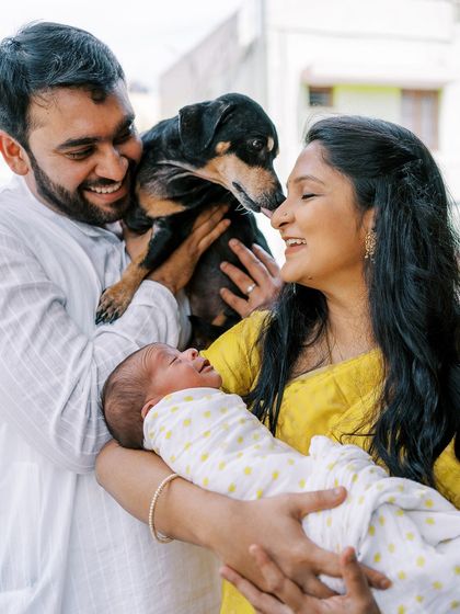 Welcoming a newborn is a family affair, and that includes furry siblings. I love capturing the moment a family becomes complete, dog and all.