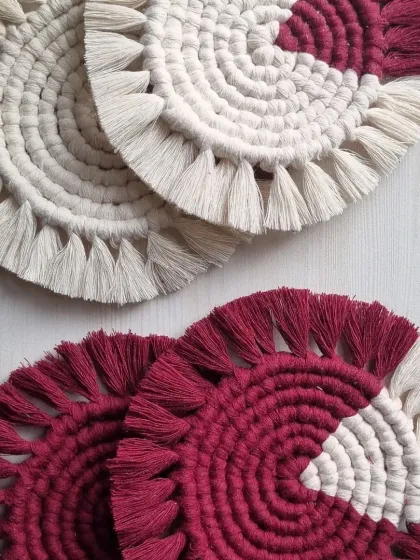 Mix and match colors for a custom set. Here are two white coasters with maroon accents and two maroon coasters with white accents.
