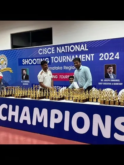 Officials and organizers on the dais during the award ceremony, with the "Champions" branding prominently displayed.