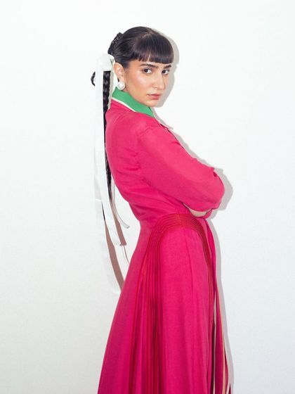 A side profile of my Bodice outfit. The look is all about layers, colors, and textures, topped off with statement platform shoes.