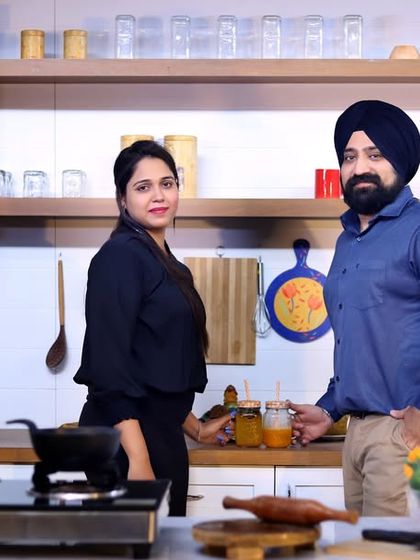 A posed portrait in the same kitchen set, showcasing a different outfit and a more direct-to-camera look. This demonstrates how we can get multiple styles from one set.