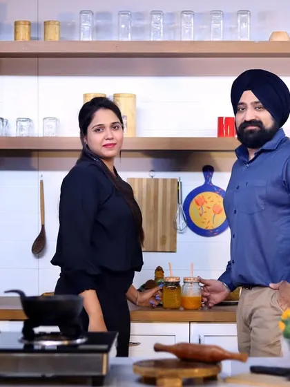 A posed portrait in the same kitchen set, showcasing a different outfit and a more direct-to-camera look. This demonstrates how we can get multiple styles from one set.