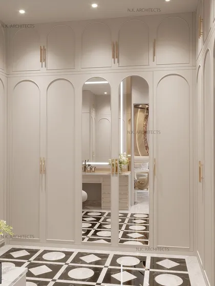We transformed this dresser area into a detailed sanctuary. From the intricate black and white flooring to the illuminated vanity mirror and organized shelving, every element adds a touch of elegance.