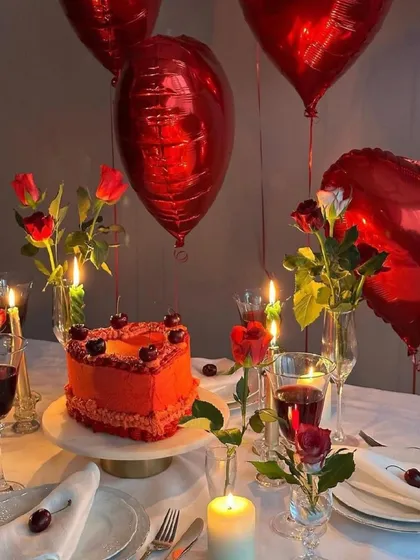 A romantic anniversary or birthday setup complete with a heart-shaped cake, red roses, and heart-shaped balloons. I curate these special moments with personalized details to make your celebration unforgettable.