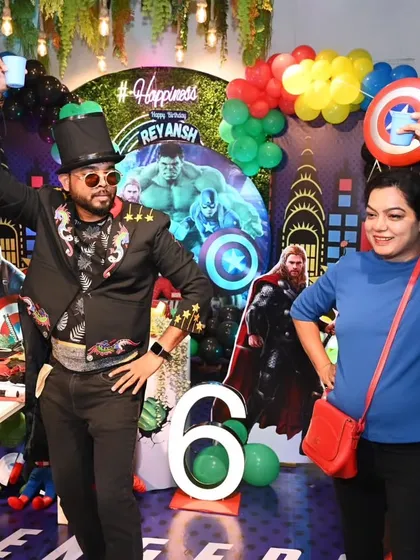 Sharing a fun moment on stage with a guest at an Avengers-themed birthday party. My shows are all about interaction and making sure the adults have just as much fun as the kids.