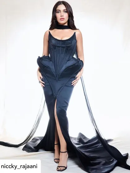 The complete look for Bhumi Pednekar, feeling like a trophy in her Andrea Brocca gown. The makeup adds to the overall sense of power and elegance.
