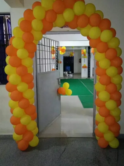 A simple and bright two-color balloon arch in orange and yellow, perfect for any festive occasion.