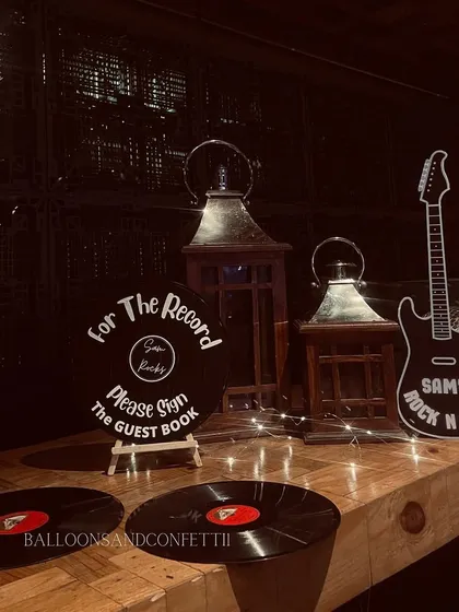 For the record, please sign the guest book. I used vinyl records and a guitar cutout as part of the themed decor for this music-lover's party.
