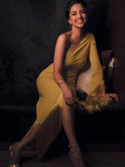 Fashion should be fun and full of life. This shot captures a moment of joy and movement, with a fringed dress that feels both chic and playful. It shows my ability to create dynamic, personality-driven images.